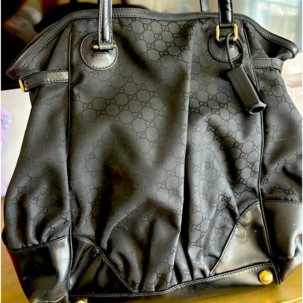 This is a gorgeous, authentic, large  Gucci bag  in. black.